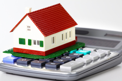 house sitting on top calculator